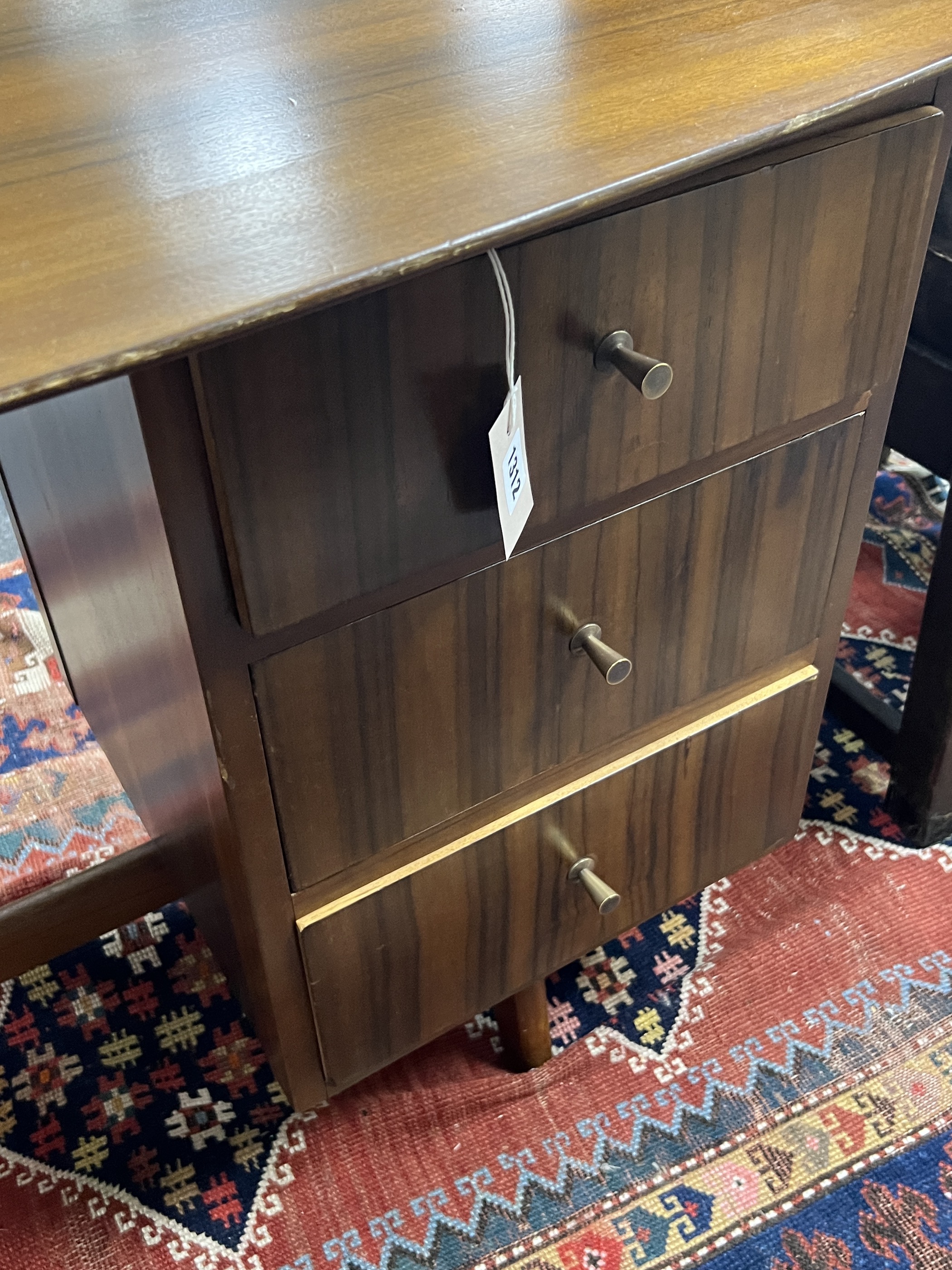 A mid century walnut desk, width 108cm, depth 64cm, height 75cm